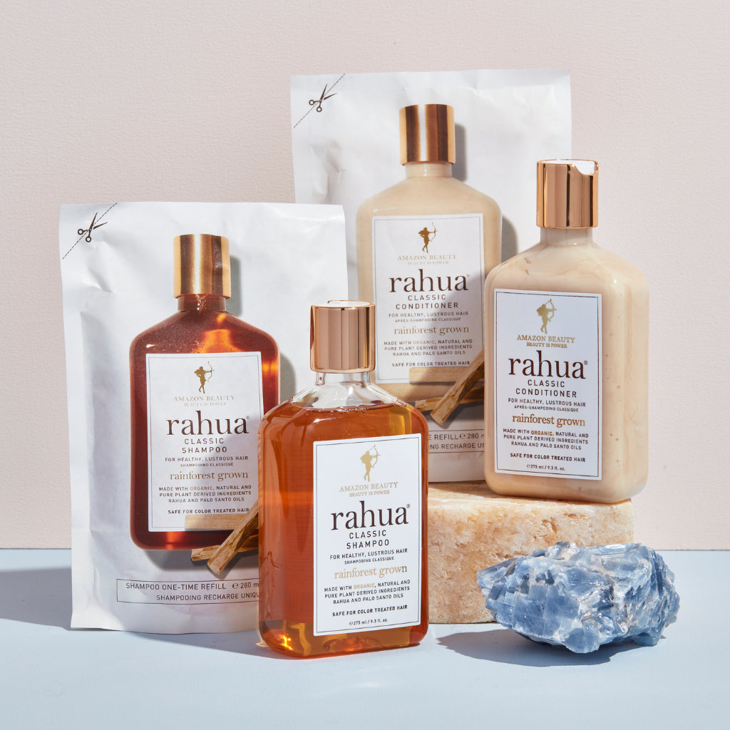 rahua classic shampoo refill and bottle with rahua classic conditioner refill and bottle placed on a marble block