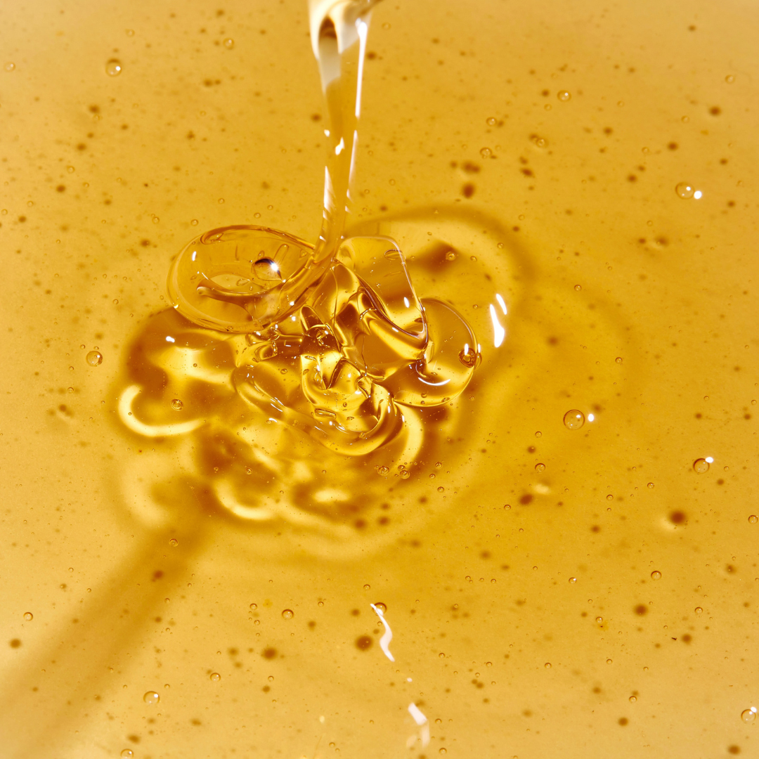 Close-up of rahua classic shampoo being drizzled onto a surface|variant:93-oz