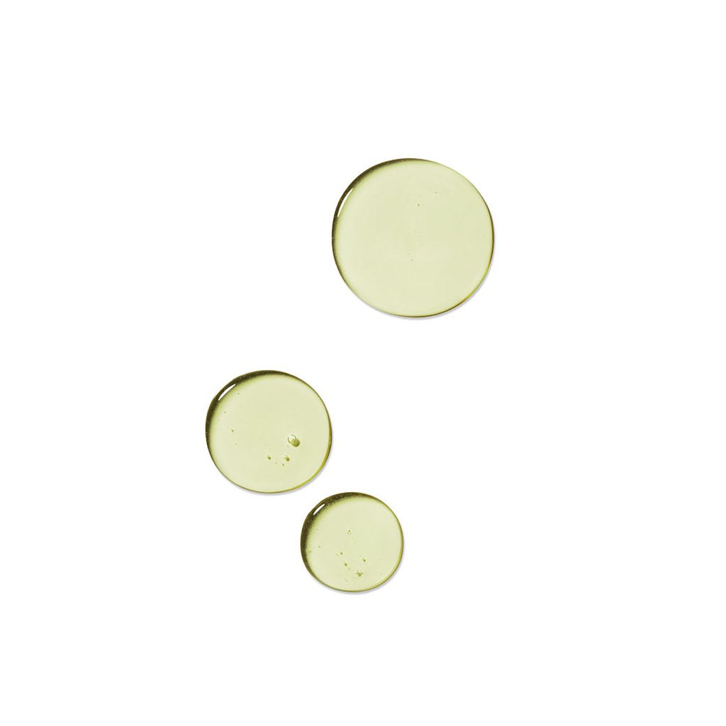 three dots of thin greenish gel liquid rahua voluminous shampoo on a white background to show texture|variant:074-oz