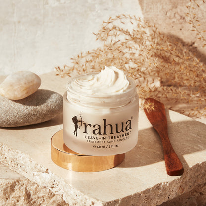Rahua Leave In Treatment with Open Lid and Leave In Treatment Light Placed on the Stone